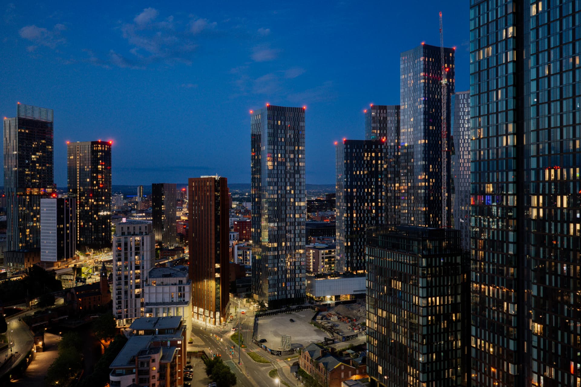 Manchester city skyline at dusk with modern residential towers